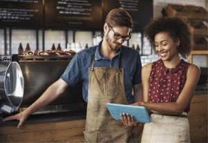 Owner showing customer a whiteboard video